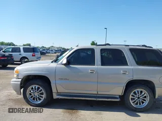 2005 GMC Yukon Denali z VIN 1GKEK63U55J266766, wystawiony jako IAAI lot #42430195 z przebiegiem Nie podano mil oraz . Historia ofert i sprzedaży dostępna na DreamBid. Obrazek 6.