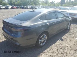 2016 Ford Fusion SE Hybrid z VIN 3FA6P0LU3GR173886, wystawiony jako Copart lot #60066015 z przebiegiem 140 328 mil mil oraz Szkoda całkowita • Salvage title. Historia ofert i sprzedaży dostępna na DreamBid. Obrazek 3.
