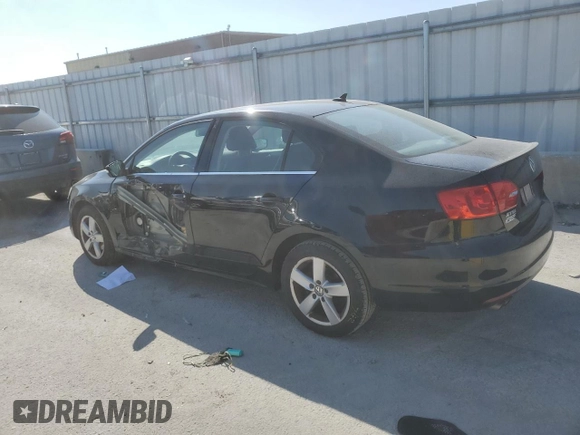 2014 Volkswagen Jetta TDI w/Premium with VIN 3VW3L7AJ2EM392016, listed as a Copart auction lot 69305904 with 111,903 mi miles and Salvage title. Bid and sale history available at DreamBid. Image 2.