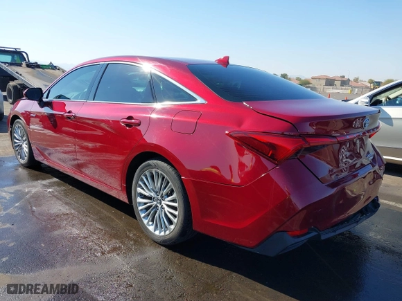 2019 Toyota Avalon Hybrid Limited with VIN 4T1B21FB8KU010221, listed as a IAAI auction lot 41470592 with 100,869 mi miles. Bid and sale history available at carsss.com. Image 3.