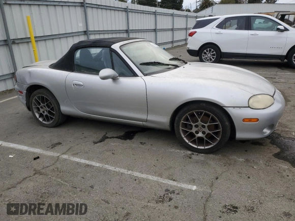2004 Mazda MX-5 Miata LS with VIN JM1NB353440402453, listed as a Copart auction lot 45064475 with 151,508 mi miles and Salvage title. Bid and sale history available at DreamBid. Image 4.