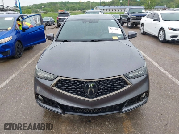 2019 Acura TLX w/A-Spec Pkg z VIN 19UUB2F61KA000932, wystawiony jako IAAI lot #42164064 z przebiegiem 79 080 mil mil oraz . Historia ofert i sprzedaży dostępna na DreamBid. Obrazek 12.