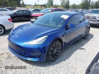 2021 Tesla Model 3 Performance with VIN 5YJ3E1EC1MF000961, listed as a IAAI auction lot 42110524 with 31,890 mi miles and . Bid and sale history available at carsss.com. Image 19.