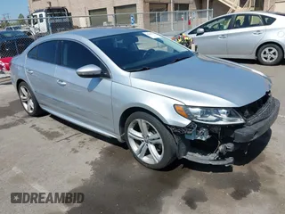 2014 Volkswagen CC R-Line with VIN WVWBP7AN0EE527649, listed as a IAAI auction lot 42009588 with 122,964 mi miles. Bid and sale history available at carsss.com. Image 1.