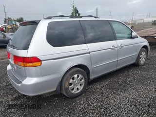 2003 Honda Odyssey EX-L z VIN 5FNRL18033B042810, wystawiony jako IAAI lot #42229495 z przebiegiem 231 682 mil mil oraz . Historia ofert i sprzedaży dostępna na DreamBid. Obrazek 4.