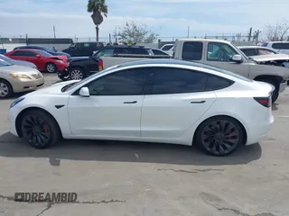 2021 Tesla Model 3 Performance with VIN 5YJ3E1EC2MF084594, listed as a IAAI auction lot 42030339 with 43,215 mi miles and . Bid and sale history available at DreamBid. Image 14.