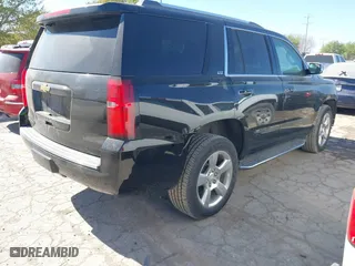 2015 Chevrolet Tahoe LTZ with VIN 1GNSCCKCXFR117525, listed as a IAAI auction lot 41839259 with 143,413 mi miles. Bid and sale history available at carsss.com. Image 4.