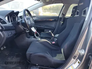 2014 Mitsubishi Lancer Evolution GSR z VIN JA32W8FV6EU018171, wystawiony jako Copart lot #77109934 z przebiegiem 83 467 mil mil oraz Tytuł czysty. Historia ofert i sprzedaży dostępna na DreamBid. Obrazek 7.