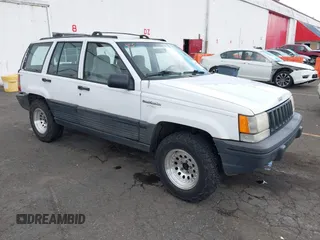 1995 Jeep Grand Cherokee Laredo z VIN 1J4GZ58S2SC645266, wystawiony jako IAAI lot #42338973 z przebiegiem 165 171 mil mil oraz . Historia ofert i sprzedaży dostępna na DreamBid. Obrazek 1.