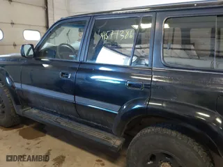 1997 Toyota Land Cruiser with VIN JT3HJ85J1V0184599, listed as a IAAI auction lot 41571386 with 305,201 mi miles. Bid and sale history available at carsss.com. Image 6.