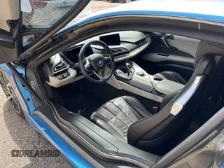 2014 BMW i8 z VIN WBY2Z2C57EVX64471, wystawiony jako IAAI lot #42244494 z przebiegiem 102 064 mil mil oraz . Historia ofert i sprzedaży dostępna na DreamBid. Obrazek 7.
