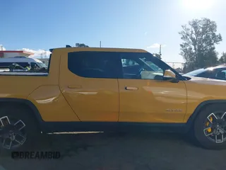 2022 Rivian R1T Adventure Package with VIN 7FCTGAAA2NN005811, listed as a IAAI auction lot 41706558 with 21,336 mi miles. Bid and sale history available at carsss.com. Image 13.
