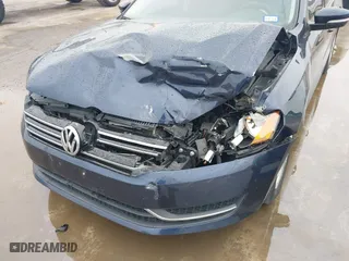 2014 Volkswagen Passat Wolfsburg Ed with VIN 1VWAS7A30EC049721, listed as a IAAI auction lot 41097234 with 139,843 mi miles. Bid and sale history available at carsss.com. Image 6.