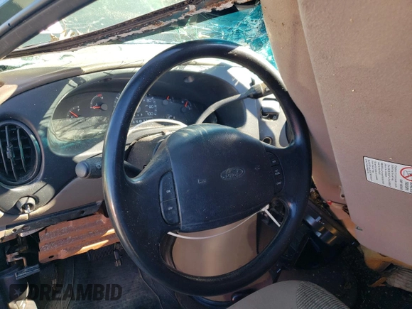 1999 Ford Econoline Passenger XL with VIN 1FBSS31L0XHB12679, listed as a Copart auction lot 74257504 with 136,821 mi miles and Salvage Title. Bid and sale history available at DreamBid. Image 8.
