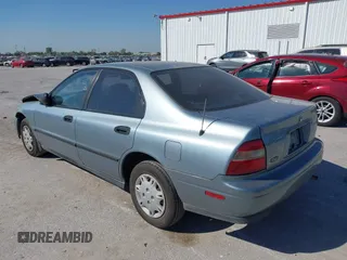 1995 Honda Accord DX with VIN 1HGCD562XSA045128, listed as a IAAI auction lot 40563511 with 143,206 mi miles. Bid and sale history available at carsss.com. Image 3.