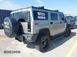 2003 Hummer H2 with VIN 5GRGN23U43H125114, listed as a IAAI auction lot 42160986 with 157,776 mi miles. Bid and sale history available at carsss.com. Image 4.