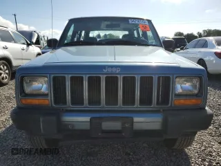 1999 Jeep Cherokee Sport with VIN 1J4FT68S1XL577603, listed as a Copart auction lot 54216115 with 180,128 mi miles and Salvage title. Bid and sale history available at DreamBid. Image 5.