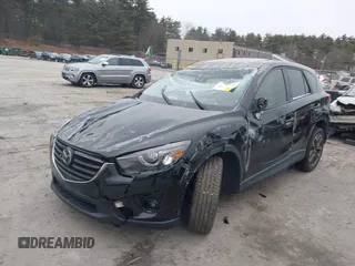2016 Mazda CX-5 Grand Touring with VIN JM3KE4DY1G0685449, listed as a IAAI auction lot 41162840 with 134,525 mi miles. Bid and sale history available at carsss.com. Image 2.