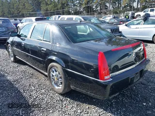 2006 Cadillac DTS 1SC z VIN 1G6KD57YX6U100634, wystawiony jako IAAI lot #41671007 z przebiegiem Nie podano mil oraz . Historia ofert i sprzedaży dostępna na DreamBid. Obrazek 3.