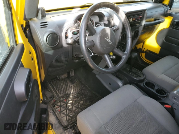 2009 Jeep Wrangler Rubicon with VIN 1J4GA64109L707008, listed as a Copart auction lot 87492674 with 157,104 mi miles and Salvage Title. Bid and sale history available at DreamBid. Image 8.