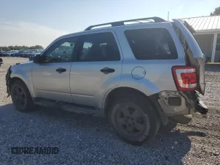 2010 Ford Escape XLS with VIN 1FMCU0C73AKA52802, listed as a Copart auction lot 60100185 with 141,541 mi miles and Clean title. Bid and sale history available at DreamBid. Image 2.