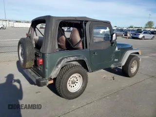 2002 Jeep Wrangler SE z VIN 1J4FA29P72P711802, wystawiony jako Copart lot #52640405 z przebiegiem 107 046 mil mil oraz Czysty tytuł • Clean title. Historia ofert i sprzedaży dostępna na DreamBid. Obrazek 3.