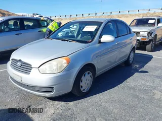 2006 Hyundai Accent GLS with VIN KMHCN46C16U023680, listed as a IAAI auction lot 41253207 with 157,398 mi miles. Bid and sale history available at carsss.com. Image 2.