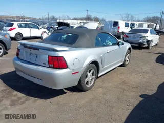 2003 Ford Mustang Deluxe with VIN 1FAFP44463F447563, listed as a IAAI auction lot 41810940 with 88,590 mi miles. Bid and sale history available at carsss.com. Image 4.