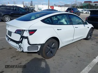 2023 Tesla Model 3 with VIN 5YJ3E1EA6PF495631, listed as a IAAI auction lot 41568118 with 10,073 mi miles and . Bid and sale history available at DreamBid. Image 4.