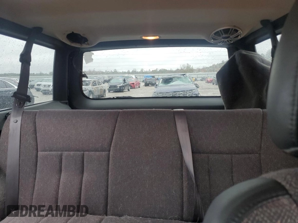 1999 Jeep Cherokee Sport with VIN 1J4FT68S1XL601799, listed as a Copart auction lot 83881844 with 203,572 mi miles and Salvage title. Bid and sale history available at DreamBid. Image 10.