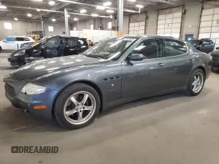 2005 Maserati Quattroporte z VIN ZAMCE39A350017390, wystawiony jako Copart lot #72455664 z przebiegiem 50 394 mil mil oraz Szkoda całkowita • Salvage title. Historia ofert i sprzedaży dostępna na DreamBid. Obrazek 1.