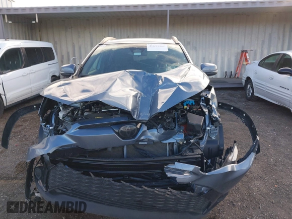 2023 Toyota Corolla Cross Hybrid S with VIN 7MUFBABG3PV005338, listed as a IAAI auction lot 41633311 with 32,082 mi miles and . Bid and sale history available at DreamBid. Image 12.