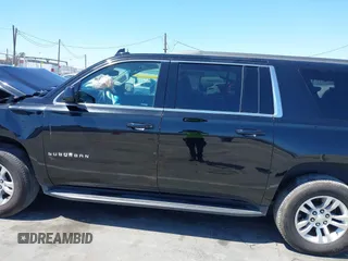 2018 Chevrolet Suburban LS z VIN 1GNSKGKC6JR150248, wystawiony jako IAAI lot #42219120 z przebiegiem 48 321 mil mil oraz . Historia ofert i sprzedaży dostępna na DreamBid. Obrazek 14.