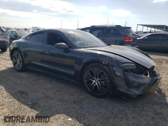 2023 Porsche Taycan with VIN WP0AA2Y18PSA16703, listed as a Copart auction lot 50559135 with 11,428 mi miles and Salvage Title. Bid and sale history available at DreamBid. Image 4.