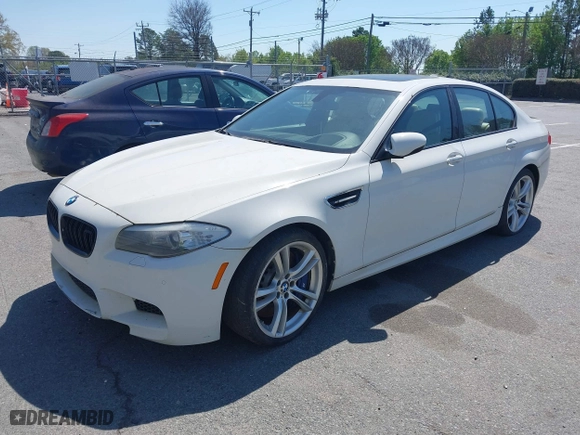 2013 BMW M5 with VIN WBSFV9C58DC773268, listed as a IAAI auction lot 41890830 with 128,399 mi miles. Bid and sale history available at carsss.com. Image 17.