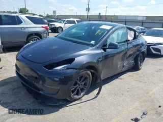 2024 Tesla Model Y with VIN 7SAYGDED9RA321373, listed as a IAAI auction lot 42228491 with 6,452 mi miles and . Bid and sale history available at DreamBid. Image 2.