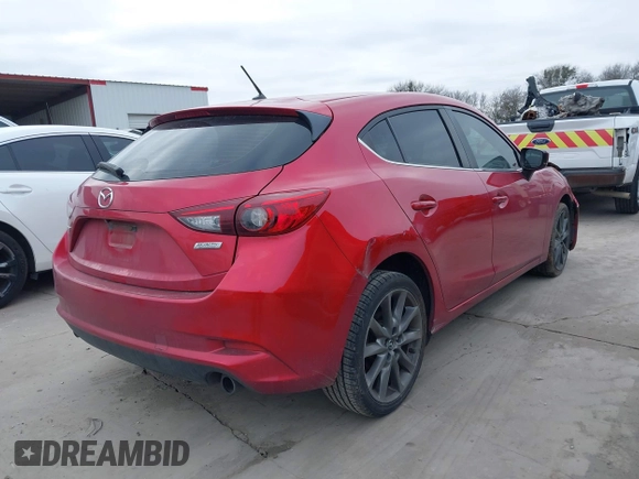 2018 Mazda 3 Touring with VIN 3MZBN1L37JM167604, listed as a IAAI auction lot 41623232 with 118,974 mi miles. Bid and sale history available at carsss.com. Image 4.