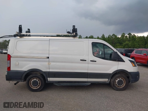 2020 Ford Transit Cargo with VIN 1FTBR1Y8XLKA19646, listed as a IAAI auction lot 42633323 with 82,577 mi miles and . Bid and sale history available at DreamBid. Image 13.