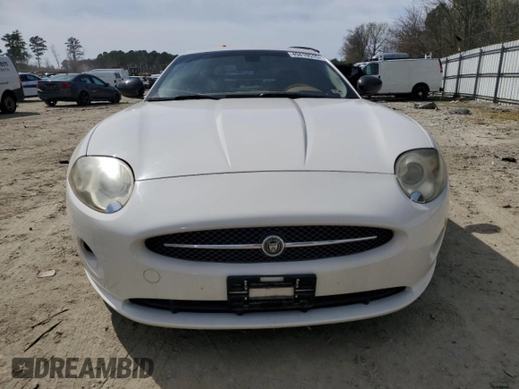2007 Jaguar XK with VIN SAJDA44B775B05606, listed as a Copart auction lot 49419515 with 115,607 mi miles and Salvage Title. Bid and sale history available at DreamBid. Image 5.
