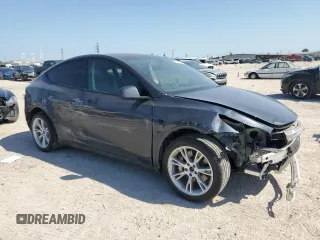 2024 Tesla Model Y Long Range with VIN 7SAYGDEE5RA282984, listed as a Copart auction lot 52388455 with 11,922 mi miles and Salvage Title. Bid and sale history available at DreamBid. Image 4.