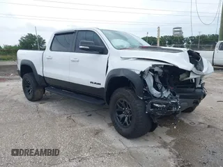 2021 Ram 1500 TRX with VIN 1C6SRFU97MN719899, listed as a IAAI auction lot 42406808 with 29,710 mi miles and . Bid and sale history available at DreamBid. Image 1.