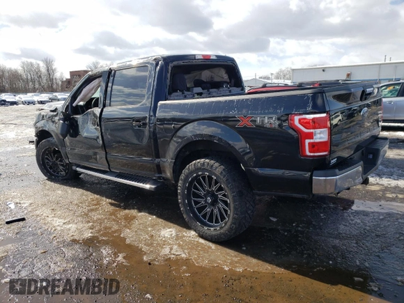 2018 Ford F-150 XL with VIN 1FTEW1E54JFB74361, listed as a Copart auction lot 45293295 with 153,456 mi miles and Salvage Title. Bid and sale history available at carsss.com. Image 2.