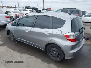 2009 Honda Fit with VIN JHMGE88279S055565, listed as a IAAI auction lot 41896359 with 184,618 mi miles. Bid and sale history available at carsss.com. Image 3.