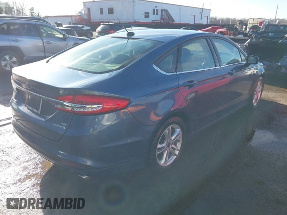 2018 Ford Fusion Hybrid SE with VIN 3FA6P0LU8JR229795, listed as a IAAI auction lot 41522818 with 115,420 mi miles. Bid and sale history available at carsss.com. Image 4.