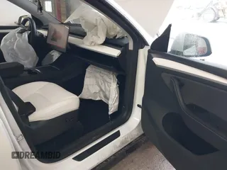 2023 Tesla Model Y Long Range with VIN 7SAYGDEE7PA100523, listed as a IAAI auction lot 40399455 with 18,885 mi miles and . Bid and sale history available at DreamBid. Image 5.