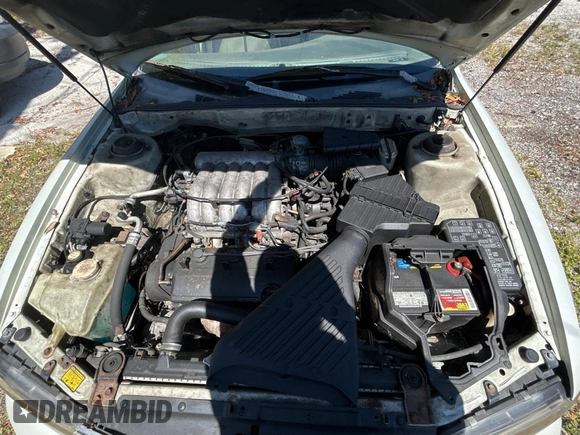 2000 Mitsubishi Diamante LS z VIN 6MMAP67P4YT001142, wystawiony jako Copart lot #49667135 z przebiegiem 243 861 mil mil oraz Tytuł czysty. Historia ofert i sprzedaży dostępna na DreamBid. Obrazek 7.