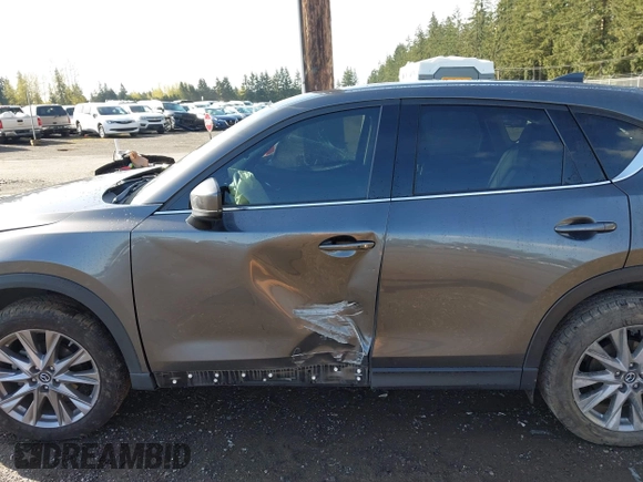 2019 Mazda CX-5 Grand Touring with VIN JM3KFBDM3K1677208, listed as a IAAI auction lot 41929299 with 58,163 mi miles. Bid and sale history available at carsss.com. Image 14.