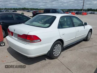 2002 Honda Accord LX z VIN 1HGCG56482A067556, wystawiony jako IAAI lot #42494292 z przebiegiem 209 511 mil mil oraz . Historia ofert i sprzedaży dostępna na DreamBid. Obrazek 4.