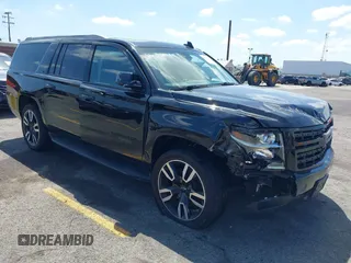2020 Chevrolet Suburban LT with VIN 1GNSCHKC9LR128203, listed as a IAAI auction lot 42275786 with 86,217 mi miles and . Bid and sale history available at DreamBid. Image 1.