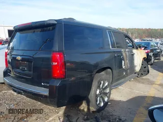 2017 Chevrolet Suburban Premier with VIN 1GNSKJKC6HR225604, listed as a IAAI auction lot 40962301 with Not Provided miles and . Bid and sale history available at DreamBid. Image 4.